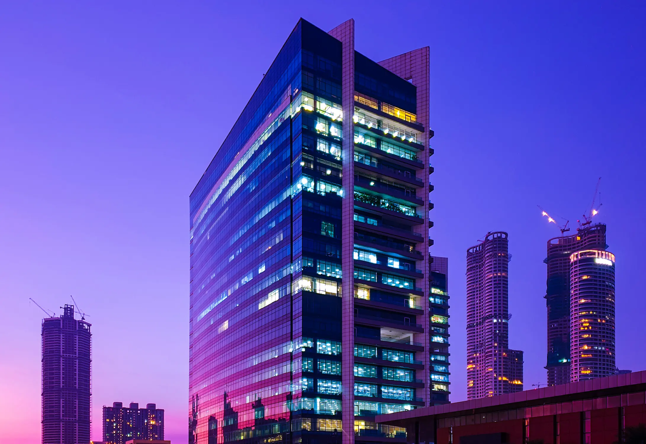 glassclad-skyscrapers-central-mumbai-reflecting-sunset-hues-blue-hour